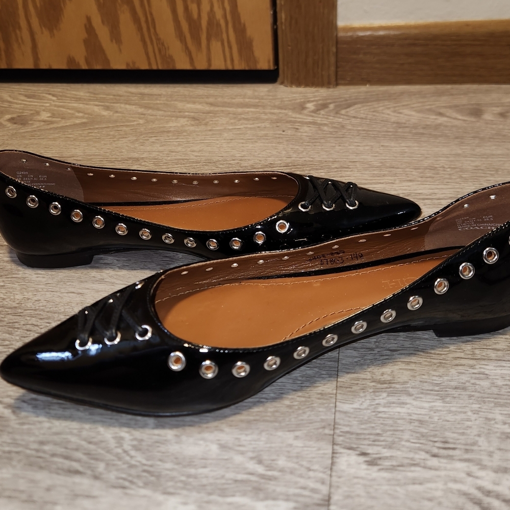 Coach Black Patent Leather Flats with Eyelet Detail